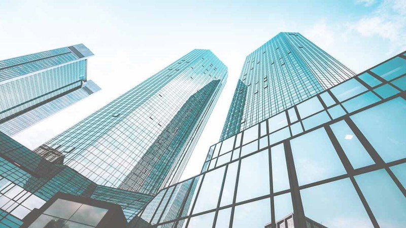 Real estate high rise glass building view from bottom
