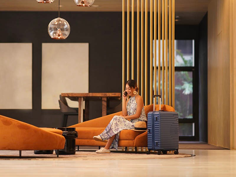 Women with mobile at living room