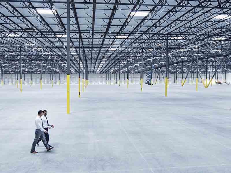 Men walking inside the warehouse