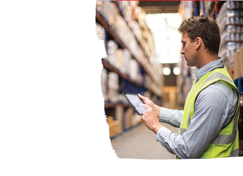 Warehouse worker checking the stock price in his tablet