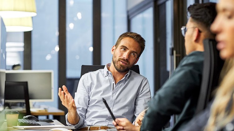 People discussing at office