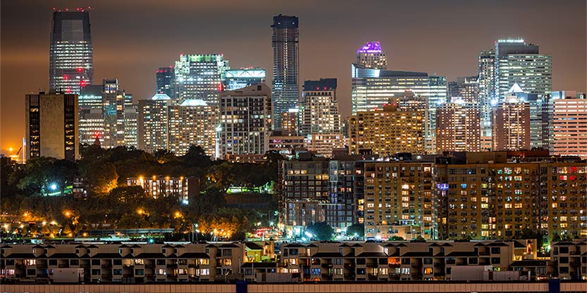 Jersey City skyline rises behind Hoboken and Weehawken cities