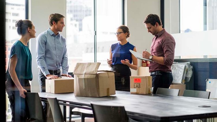 People and boxes in an office