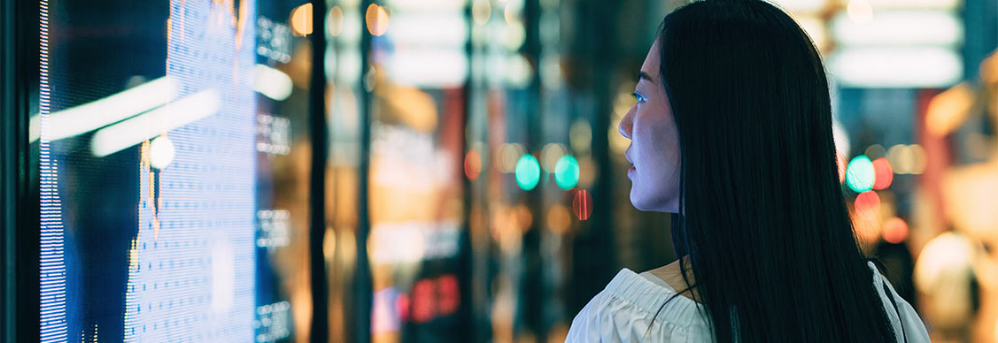 A female looking into reits breaking stock list