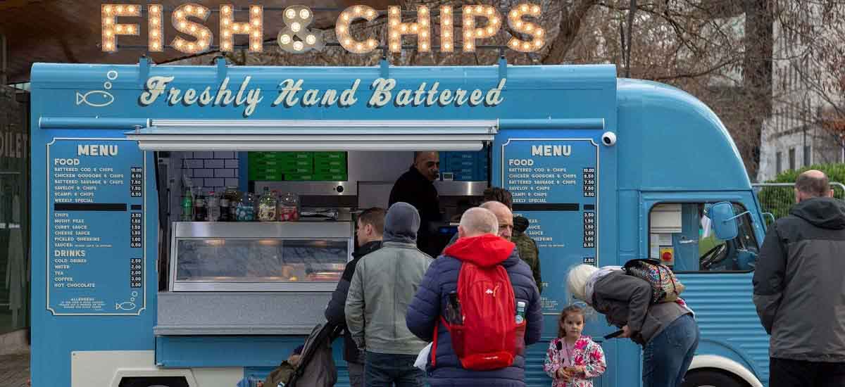 People waiting infront of a food truck