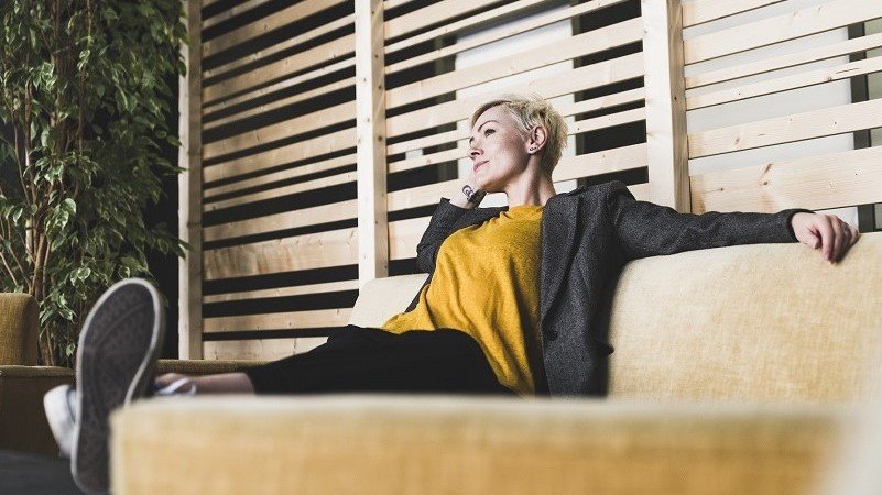 Woman relaxing on the couch after the hectic meeting