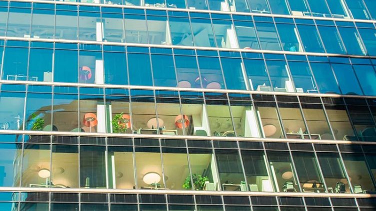 side glass view of a real estate building to boost energy efficiency