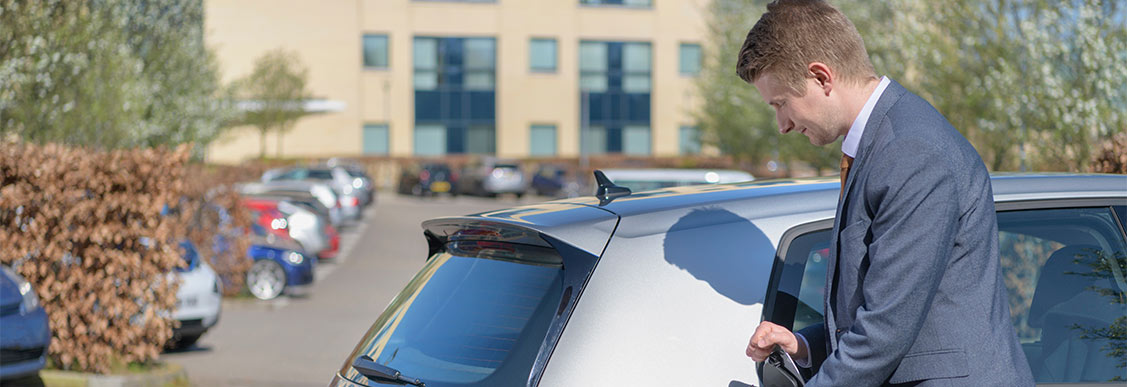 Man charging his electric car