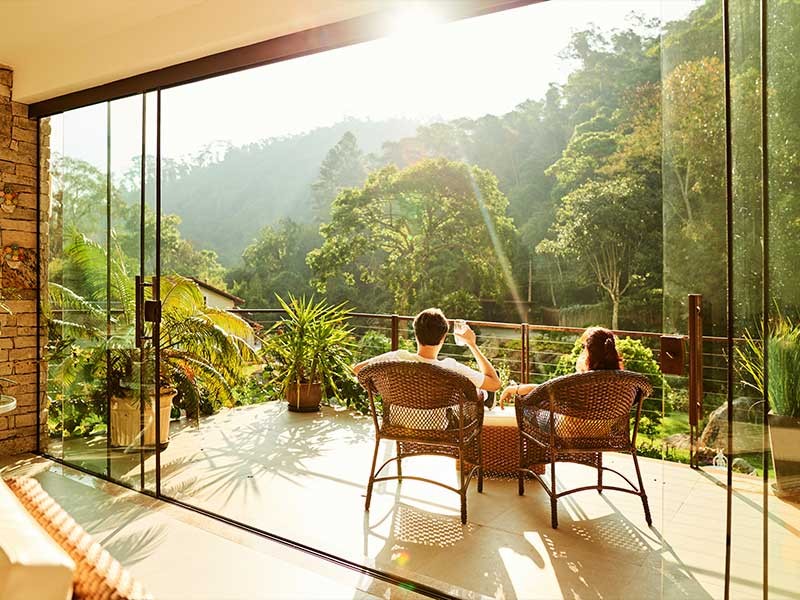 A couple having coffee while sitting